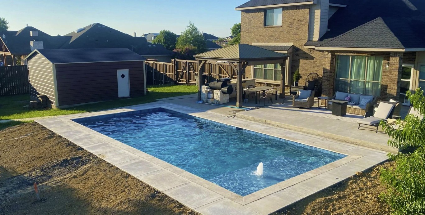 Beautiful backyard pool with patio in Duncanville, TX